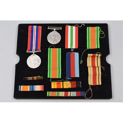 249 - Two George VI WWII 1939 to 1945 Medals with a selection of Ribbons and Bars