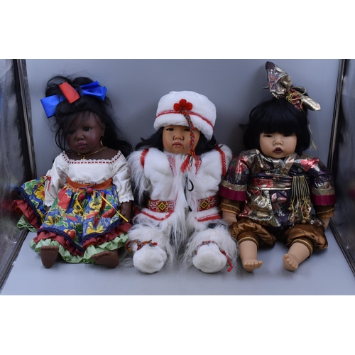 266 - Three dolls to include Japanese, Eskimo and African each measuring 21