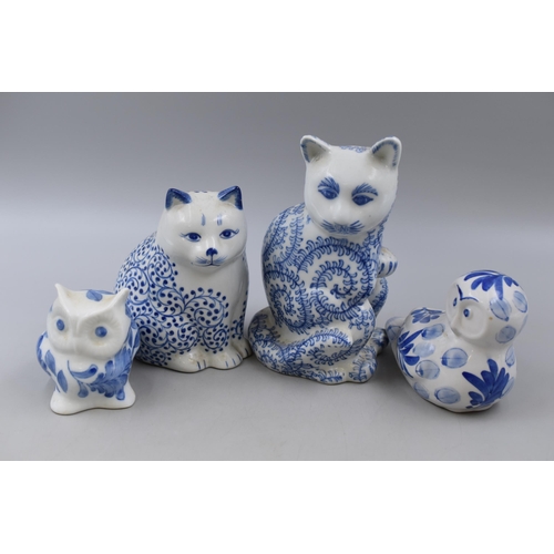 269 - Selection of blue & white ceramics to include two cats and two owls largest 8