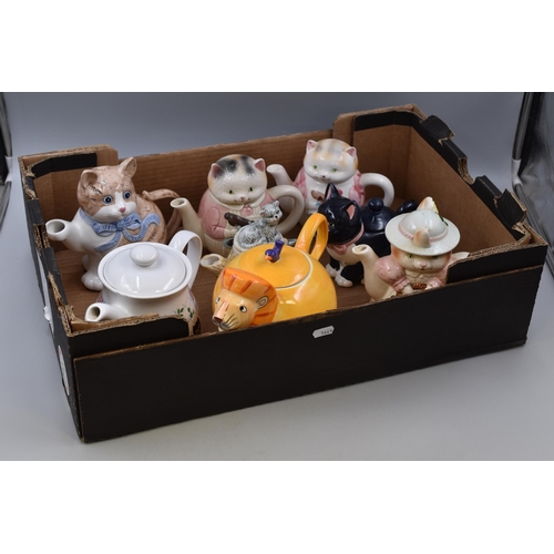 278 - Eight cat themed novelty tea pots