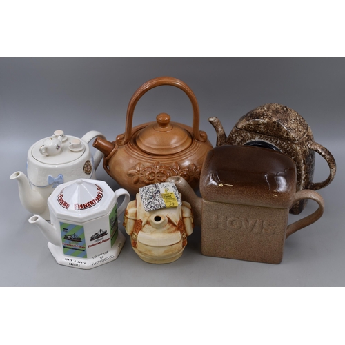 279 - Six novelty tea pots to include Fishermans friend, radio, Hovis, back pack, oriental and table