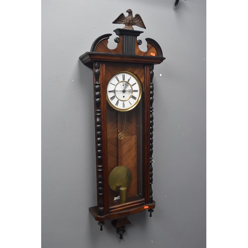 520 - An Early 20th Century Weight Driven Vienna Wall Clock With Eagle Finial, Key and Weight. Approx 120c... 