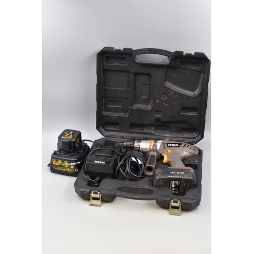 573 - Titan cordless drill for spare and repairs with battery and charger and also a dewalt battery and ch... 