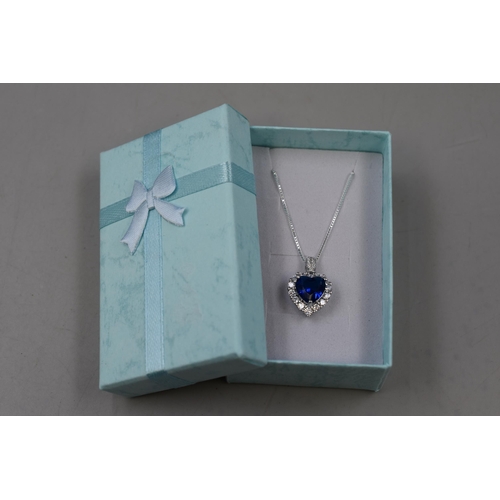 51 - A 925. Silver Blue Heart Surrounded By Clear Stones Pendant Necklace, In Presentation Box