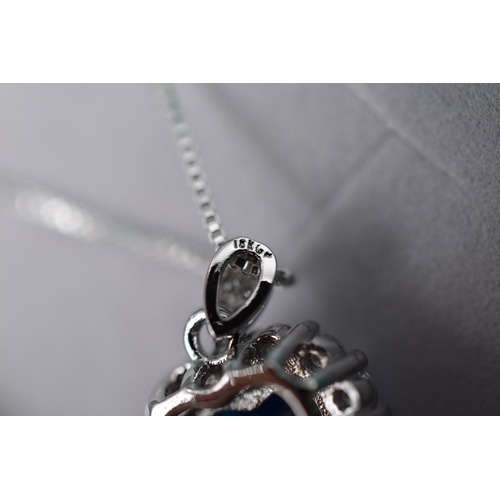 51 - A 925. Silver Blue Heart Surrounded By Clear Stones Pendant Necklace, In Presentation Box