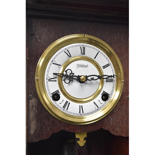 336 - Highlands pendulum wall clock measuring 22