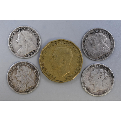 160 - Four Victoria Silver Threepences and a 1946 Threepence