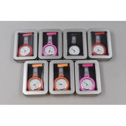 251 - Seven Brand New Nurses Fob Watches in Various Colours with Storage Tins .