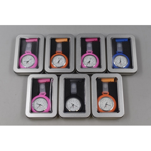 252 - Seven Brand New Nurses Fob Watches in Various Colours with Storage Tins .