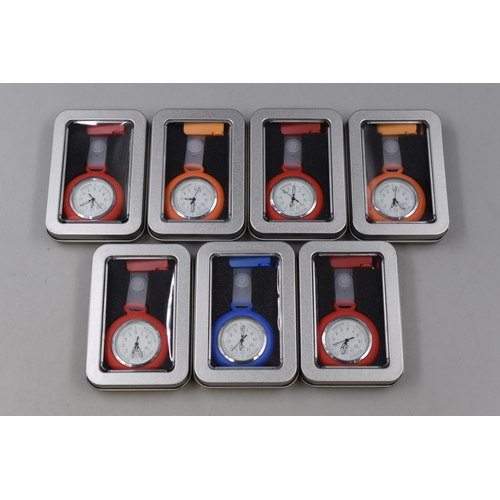 255 - Seven Brand New Nurses Fob Watches in Various Colours with Storage Tins .