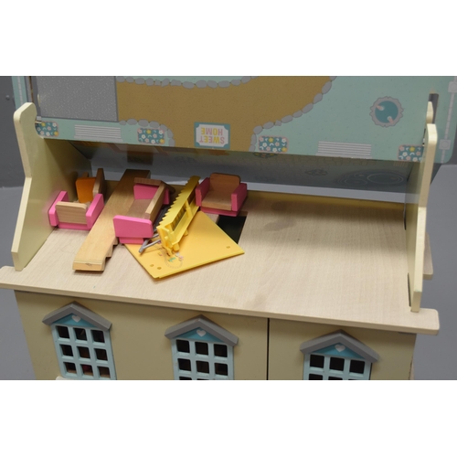 543 - Wooden dolls house with some furniture (A/F)