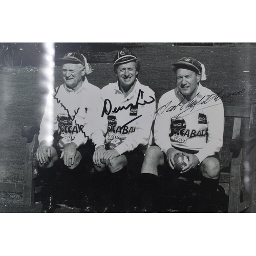 527 - Framed and Glazed Facsimile Signed Photo Of Three Football Legends, Denis Law, Nat Lofthouse and Tom... 