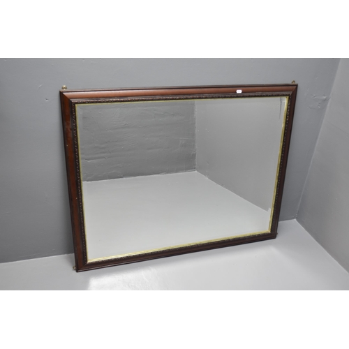 585 - A Large Wood Framed Wall Mounted Bevel Edged Mirror, Approx 113cm x 88cm