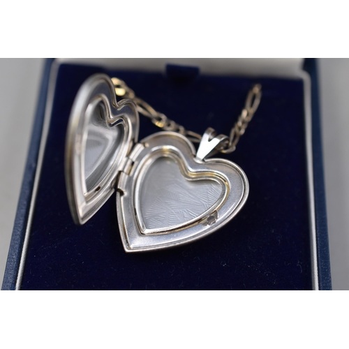 16 - A Sterling Silver 'Love You' Heart Locket, on 925. Silver Figaro Curb 3:1 Necklace Chain