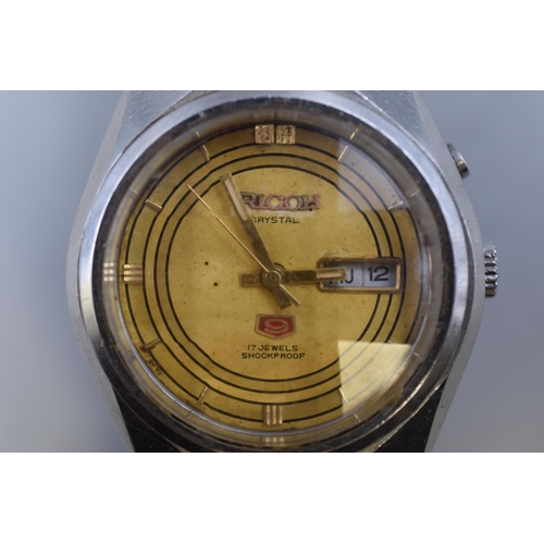 85 - A Ricoh Crystal 9 21 Jewels Automatic Gents Day/Date Watch, With Original Strap. Working, Dial Says ... 