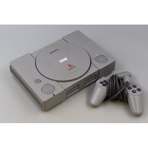 401 - A Sony PlayStation Console, With Controller. Powers On When Tested