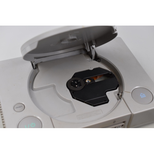 401 - A Sony PlayStation Console, With Controller. Powers On When Tested