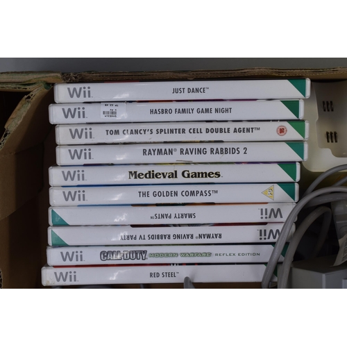 395 - Two Nintendo Wii Consoles (Power On), With Ten Games, Four Controllers, Nunchuks, And Other Accessor... 