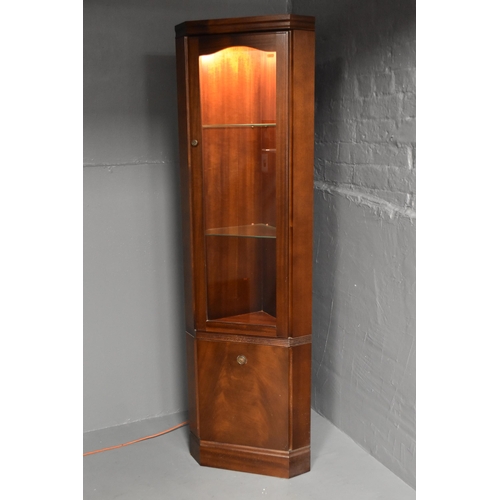 582 - Corner display unit in dark wood with two glass shelves to the top and one cupboard to the bottom wi... 