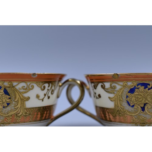 291 - A Handpainted Blue, Orange and Gilt Noritake Twenty Piece Tea Service. Six Trios, Milk Jug, And Suga... 