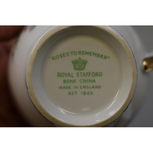 258 - A Twenty-One Piece Royal Stafford 'Roses To Remember' Tea Service. Includes Six Trios, Milk Jug, Sug... 