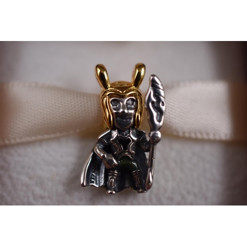 63 - A Pandora x Marvel 925. Silver and 14k Gold Plated Loki Charm, In Presentation Box