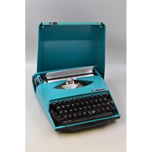 383 - Smith corona typewriter designed by ghia in green and black