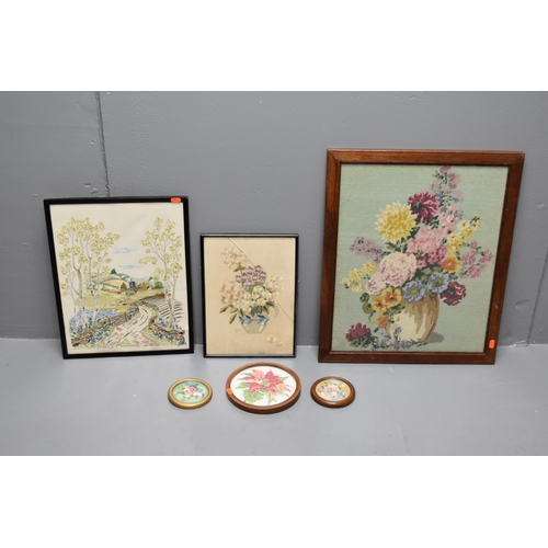 598 - Six embroidered pictures 4 of them are of flowers one has broken glass picture frame and 1 is of a c... 