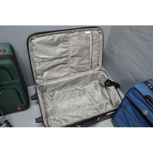 635 - A Selection of Six Suitcases And Cathay Pacific Holdall/Travel Bag To Include Pierre Cardin, Chubb, ... 