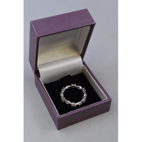 53 - A 925. Silver Clear Stoned Eternity Ring, Size N. In Presentation Box