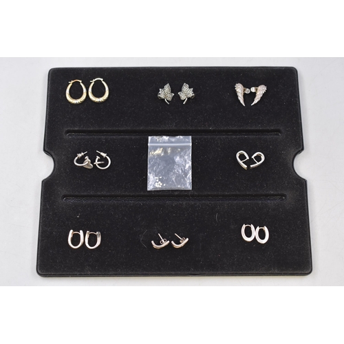 60 - Eight Pairs of Silver Rings with a Collection of Diamond Chips