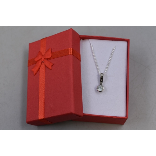 62 - A Marcasite and Blue Topaz Stoned Pendant, On 925. Silver Chain. In Presentation Box