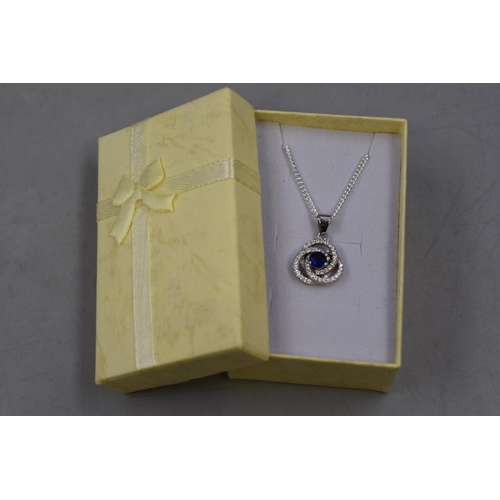 64 - A 925. Silver Clear and Blue Stoned Swirl Pendant Necklace, In Presentation Box