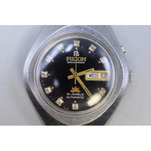 82 - A Ricoh 21 Jewels Automatic Day/Date Gents Watch With Black and Clear Stoned Dial, With Leather Stra... 