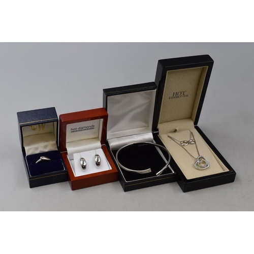 85 - Four Boxed Silver 925 Hot Diamonds jewellery including Bangle, Ring two Pendant Necklaces and a Pair... 