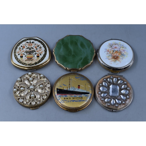 119 - Six ladies powder compacts to include 3 Stratton 'RMS Scythia', floral and green onyx plus 3 others.