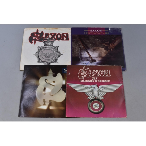 Four Saxon 7" Vinyl Singles To Include 747, Ride Like The Wind, I Can't Wait Anymore, And Strong Arm of The Law
