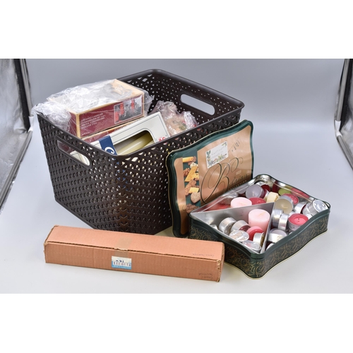 Large mixed lot of candle related items to include tea light candles, stick candles, candles holders and a boxed candle snuffer