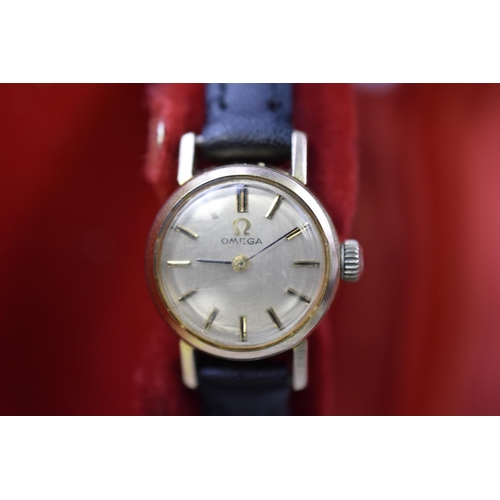 51 - An Omega Ladies Mechanical Watch, With Black Leather Strap. In Working Order, With Smiths Watch Pres... 