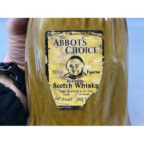 267 - Two Figurines to Include Abbots Scotch Whiskey Decanter and a Buddha Statue (A/F)