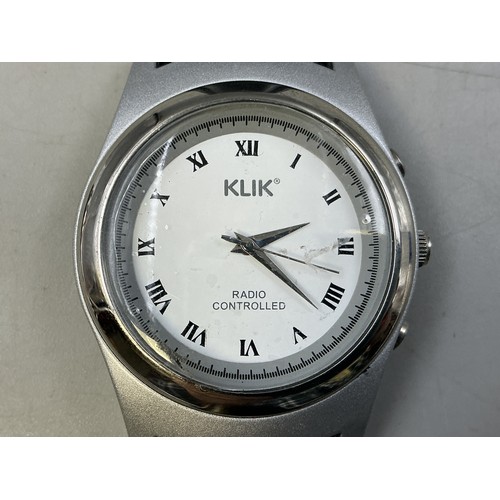 37 - A Klik Gents Quartz Radio Controlled Watch - White Light Up Dial, With Black Leather Strap. Working