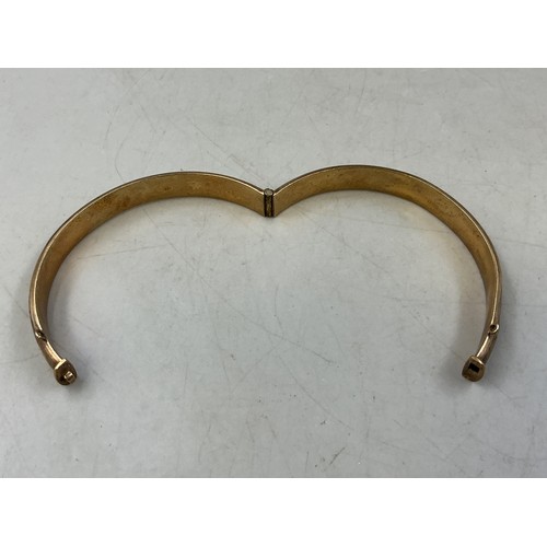 6 - A Hallmarked 9ct Gold Etched Bangle