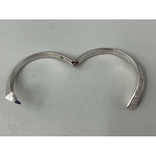 24 - Hallmarked 18ct White Gold Hinged Back Cross Over Hoop Bangle Set with 2.93cts of Diamonds come comp... 