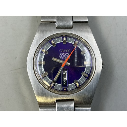 105 - A Gents Camy 25 Jewels Automatic Day/Date Watch - Unusual Purple Dial, Stainless Steel Case and Stra... 