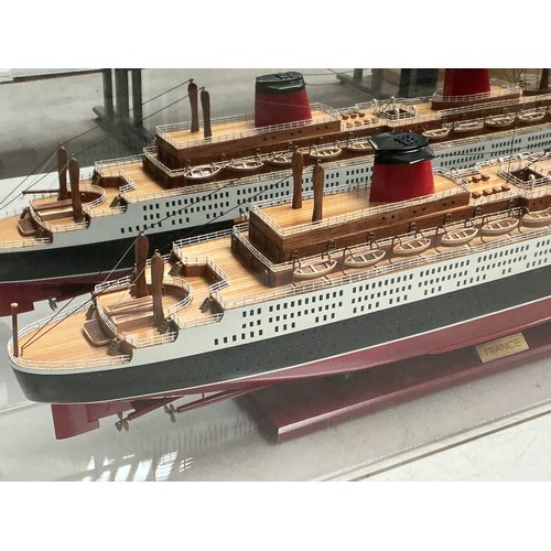 50 - A Large Handmade Cased ship Model of The Ocean Liner 'SS France', it is a replica of the ship launch... 