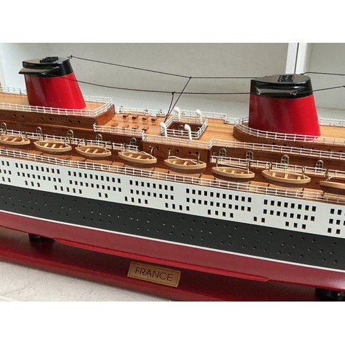 50 - A Large Handmade Cased ship Model of The Ocean Liner 'SS France', it is a replica of the ship launch... 