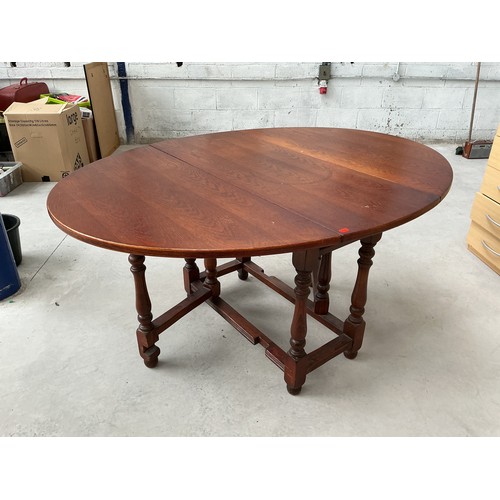492 - Highly Polished Mid Century Solid Teak Oval Dropleaf Table Displaying Stunning Wood Grain Patternati... 