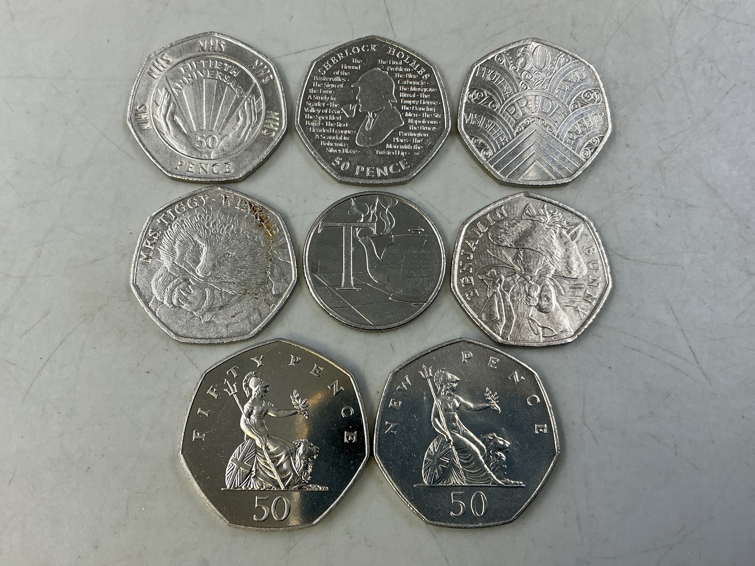 Seven Collectable 50p Coins including Sherlock Holmes, Mrs Tiggy Winkle ...