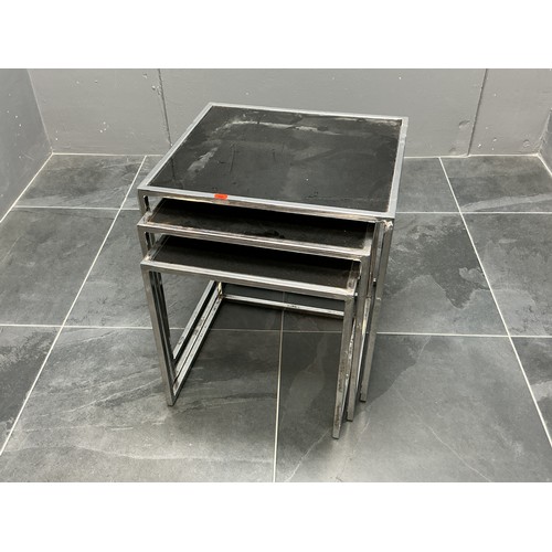 35 - A Nest of Three Chrome Framed Tempered Black Glass Topped Side Tables, Approx 45cm x 50cm x 52cm