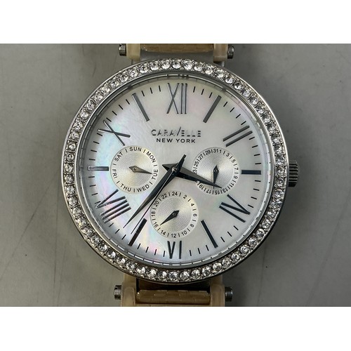92 - A Caravelle New York By Bulova Ladies Quartz Calendar Watch - Mother of Pearl Dial, Clear Stoned Bez... 